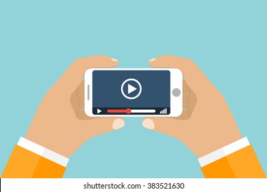 Hand holds smartphone. Video player application on your mobile phone screen. Watching videos on the phone.  Vector flat. Mobile video streaming technologies. 