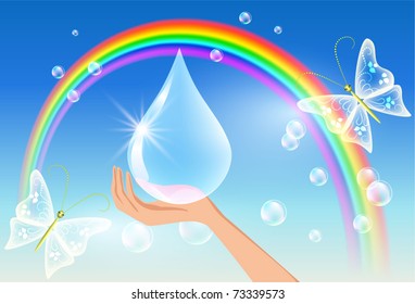 The hand holds a sparkling drop against a rainbow. Symbol of clean water.
