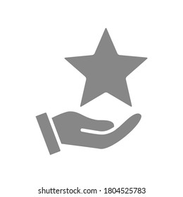 Hand holds star on palm gray icon. Charity, add to favorites, customer review, rating symbol