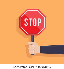 Hand holds stop sign flat design illustration