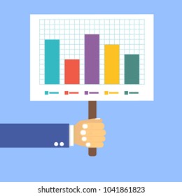 hand holds a table with a graph on a blue background