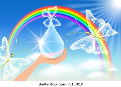 The hand holds a transparent butterfly against a rainbow. Symbol of environmental protection