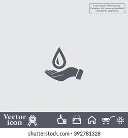 Hand holds water drop symbol. 