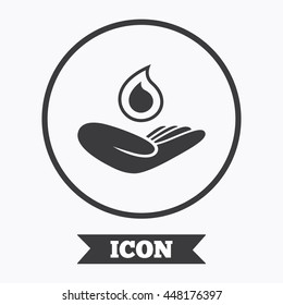 Hand holds water drop symbol. Environmental protection symbol. Graphic design element. Flat symbol in circle button. Vector