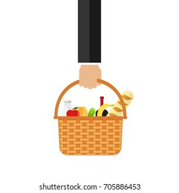 The hand holds a wicker basket with food. Basket with food in hand. Flat design, vector illustration, vector.