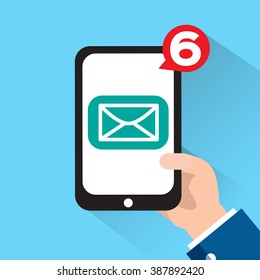 Hand holing smart phone with Email symbol on the screen. Using smartphone similar to smart phone