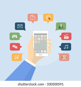 Hand holing white smart phone with icon set in flat design on blue background (vector)