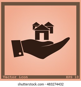 Hand with house icon
