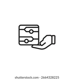 A hand icon holds a rectangular object with circuitry lines and circular elements, representing a chip, integrated circuit, or electronic component.