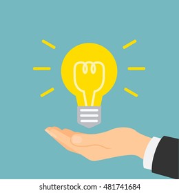 Hand with idea light bulb. Concept of innovation, solution, new plan and electricity.