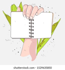 hand illustration opens a book with an illustration of a flower behind it