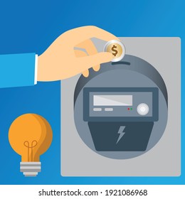 Hand inserting a coin in an energy meter