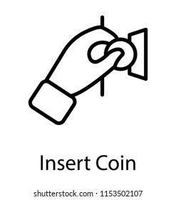 
A hand inserting a coin in money box 
