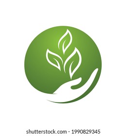 Hand and leaf green nature logo element vector