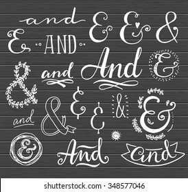 Hand lettering calligraphic catchwords and ampersands on a blackboard