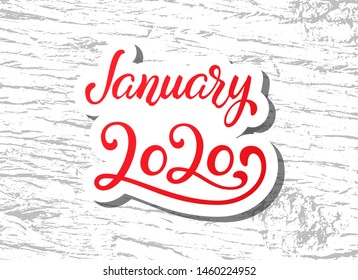 Hand Lettering January 2020. Calligraphy quote for 2020 year calendar. Brush calligraphy for winter invitation card, poster, greeting card, calendar, planner and bullet journal on wood background.