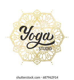 Hand lettering logo for yoga studio. Gilding mandala elements. Vector illustration.