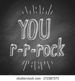 Hand lettering slogan you rock on black chalkboard background. Can be used as poster. Vector illustration. 