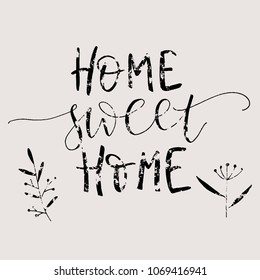 Hand lettering typography poster.Calligraphic quote with floral elements 'Home sweet home'. For housewarming posters, greeting cards, home decorations.Vector illustration.