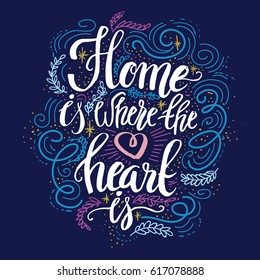 Hand lettering typography poster.Calligraphic quote 'Home is where the heart is'.For housewarming posters, greeting cards, home decorations.Vector illustration.