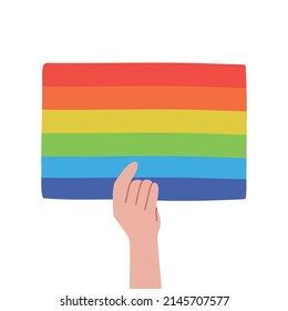Mano con afiche LGBT. Bandera del Orgullo de manos y arcoiris. Concepto LGBT. 