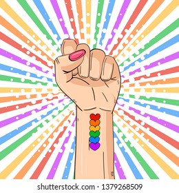 Woman’s hand, the LGBTQ theme. Pride Month.  LGBT equal rights movement and concept of gender equality.Pop art vector illustration.