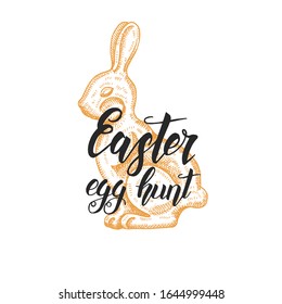 Hand made lettering -Easter egg hunt. Vintage hand drawn doodle chocolate bunny. Sketch. Spring. Vector engraving illustration. 