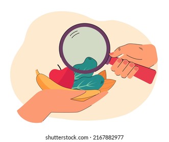 Hand with magnifying glass exploring groceries. Female hand holding fruits and vegetables. Choosing products concept for website or landing page