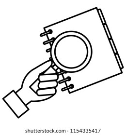 hand with magnifying glass and notebook