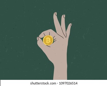 Hand making OK sign around bitcoin, bitcoin is good currency concept