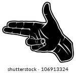 A hand making a shape of a pointed hand gun