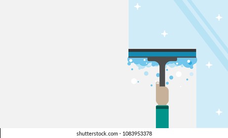 Hand of a man clean up the window by glass wiper cleaner.