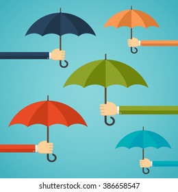 Hand of man holding an umbrella. Insurance concept.