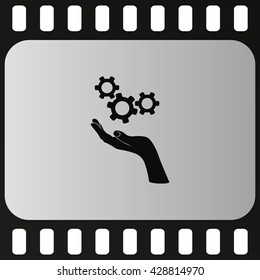 Hand and mechanism icon.