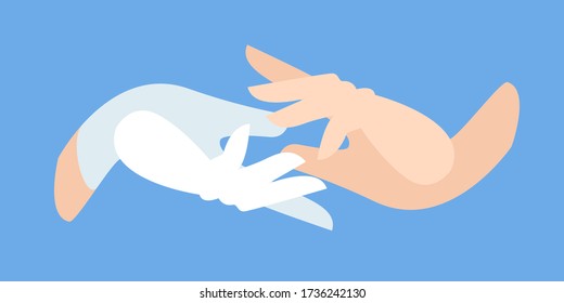 hand of a medic in a protective white glove takes the patient’s hand. Latex gloves as a symbol of protection against viruses and bacteria. medical care. helping hand of a paramedic. first aid.