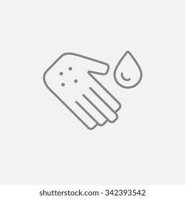 Hand with microbes and water drop line icon for web, mobile and infographics. Vector dark grey icon isolated on light grey background.