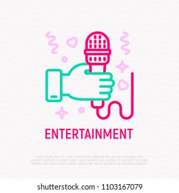Hand with microphone thin line icon. Karaoke, interview, singer symbol. Modern vector illustration.