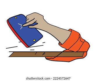 A hand and mobile phone upon a table
