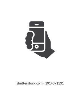 Hand with mobile phone vector icon. filled flat sign for mobile concept and web design. Smartphone selfie photo glyph icon. Symbol, logo illustration. Vector graphics