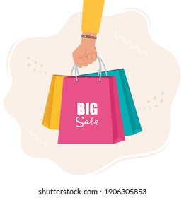 Hand with multicolored shopping bags. Big sale concept vector Illustration