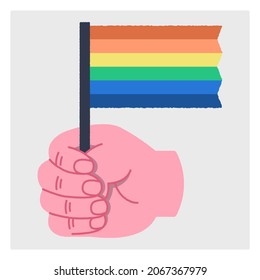 Сolorful hand with an object in it. LGBT flag. Concept of support for the LGBT community. Flat ripped illustration. Vector isolated image