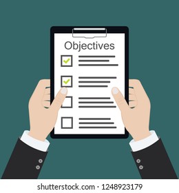 In hand. Objective board goal check list