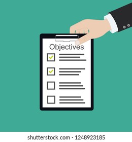 In hand. Objective board goal check list