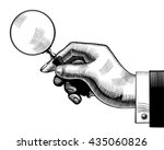 Hand with an old magnifying glass. Retro style search sign and icon. Vintage engraving stylized drawing. Vector illustration