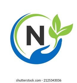 Hand On Letter N Logo Design. N Healthcare Care, Foundation with Hand Symbol