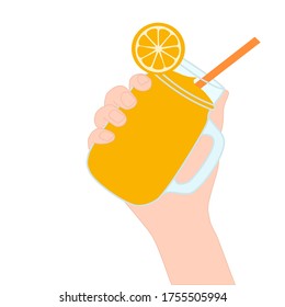 Hand is holding​ a orange smoothie in a glass cup with and has orange slice on top. A cold soft drink for summer. Sweet beverage. Tasty and yummy food. A takeaway Product logo or advertisement.