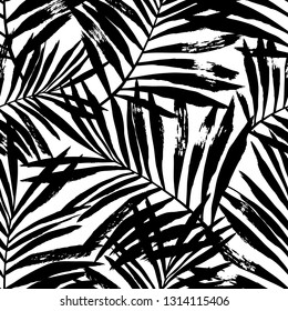 Hand painted black vector palm leaves seamless pattern on white background. Perfect for fabric, wallpaper or wrapping paper.