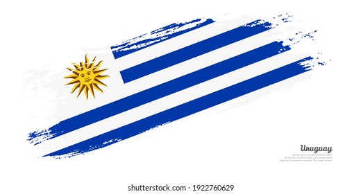 Bandera pintada a mano del pincel Uruguay país con una elegante bandera sobre fondo blanco
