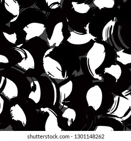 Hand painted brush strokes in white and pastel pink on black background. Seamless abstract repeating background