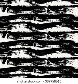 Hand painted dry brush strokes in black on cream background. Seamless abstract repeating background.